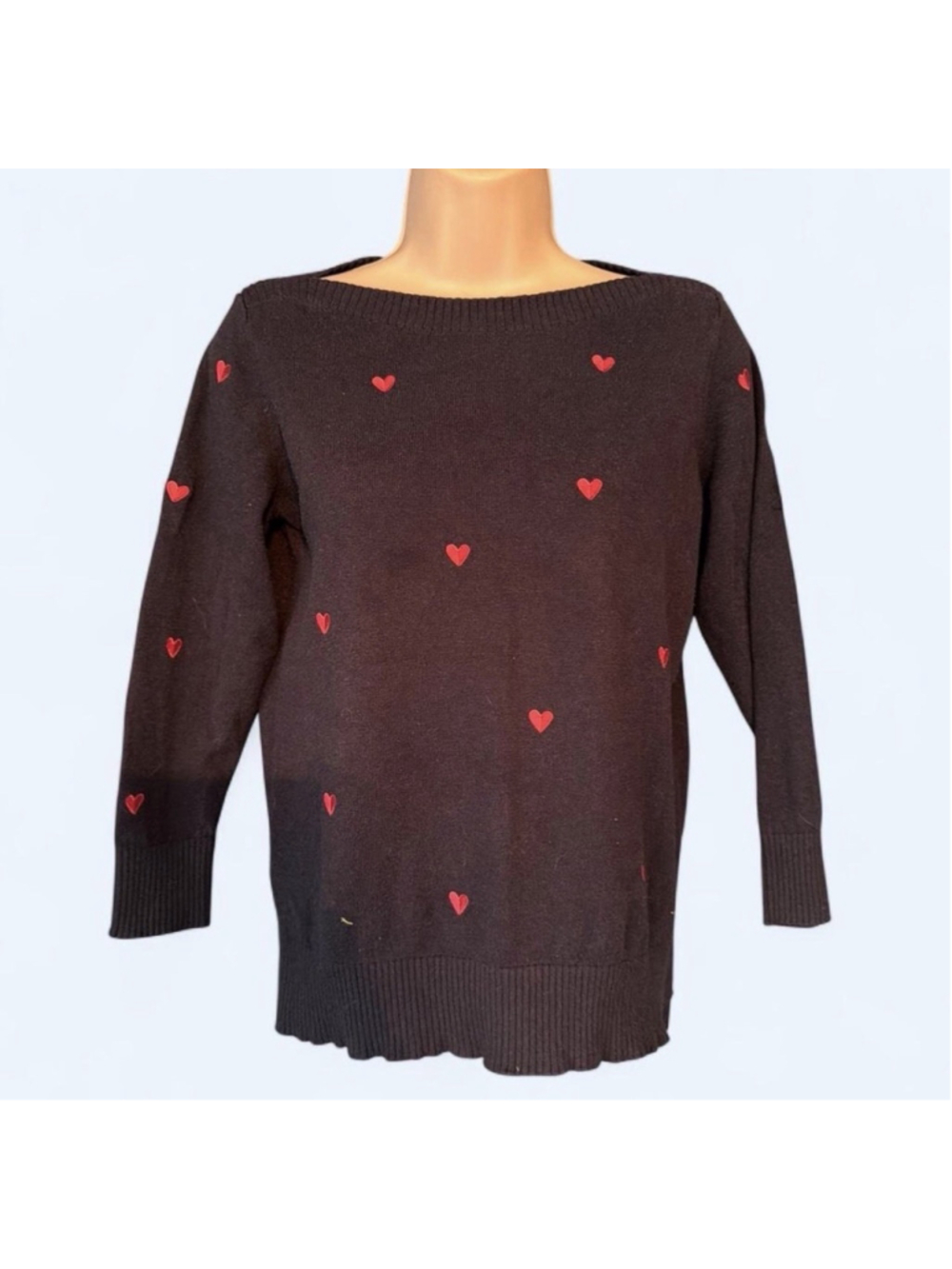 Navy blue sweater with red hearts
